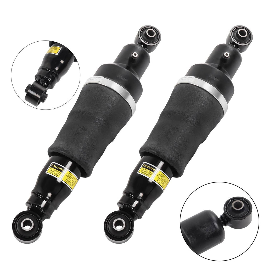 Pair of black rear air suspension shock struts with silver bands and rubber bodies