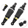 Pair of black rear air suspension shock struts with silver bands and rubber bodies