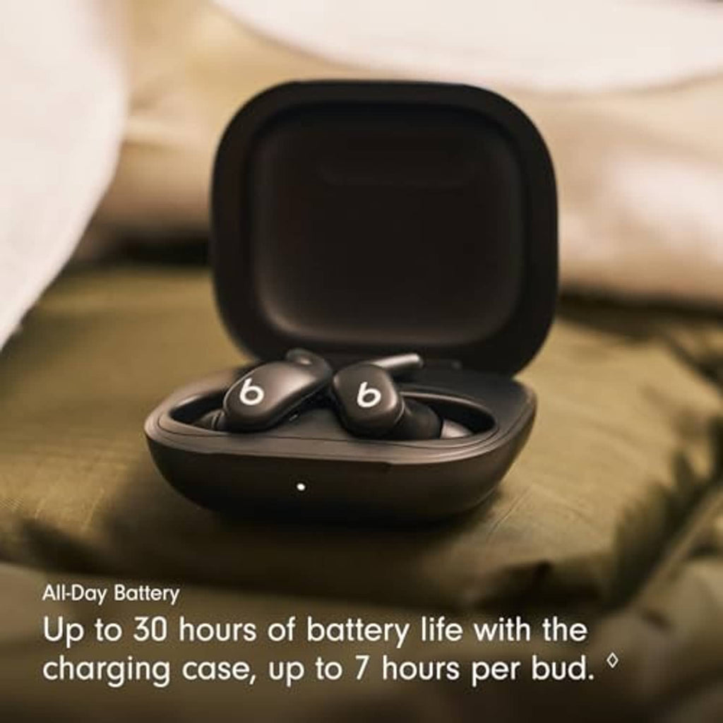 Dark wireless earbuds resting in open charging case
