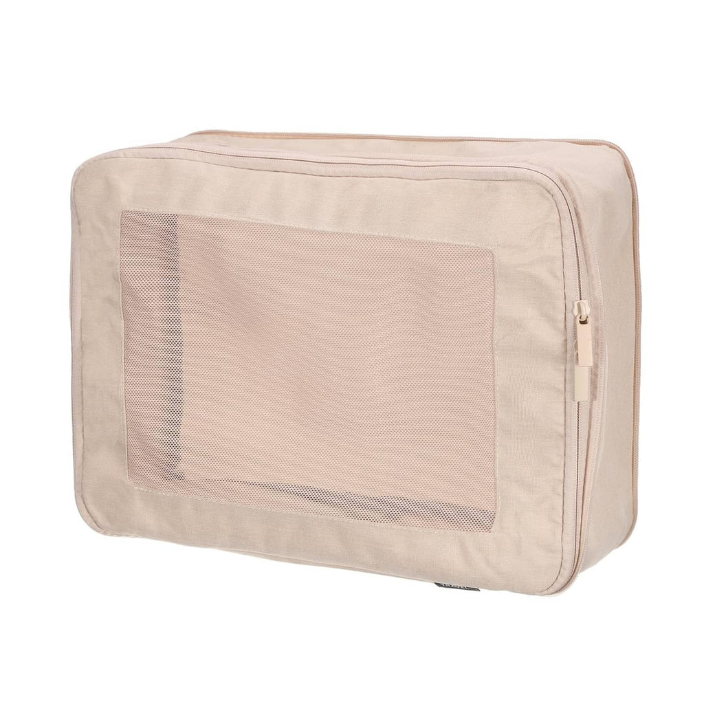 Beige compression packing cube with mesh front panel and zip closure
