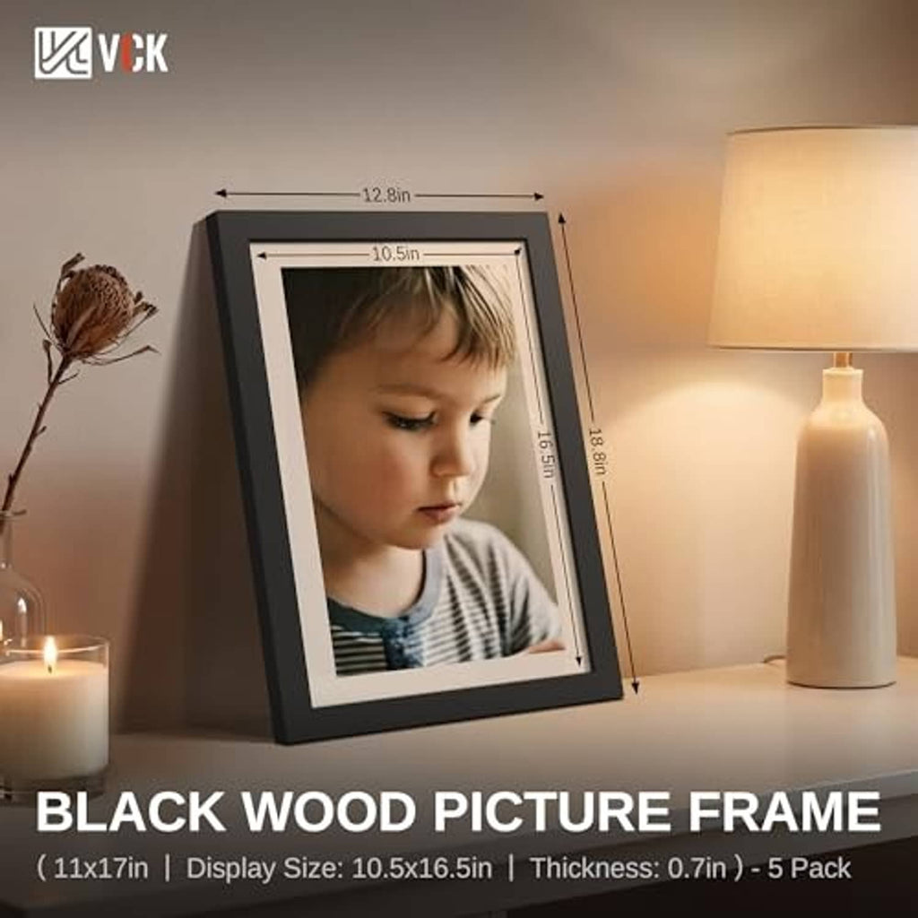Black 11x17 picture frame with child portrait photo, angled on display