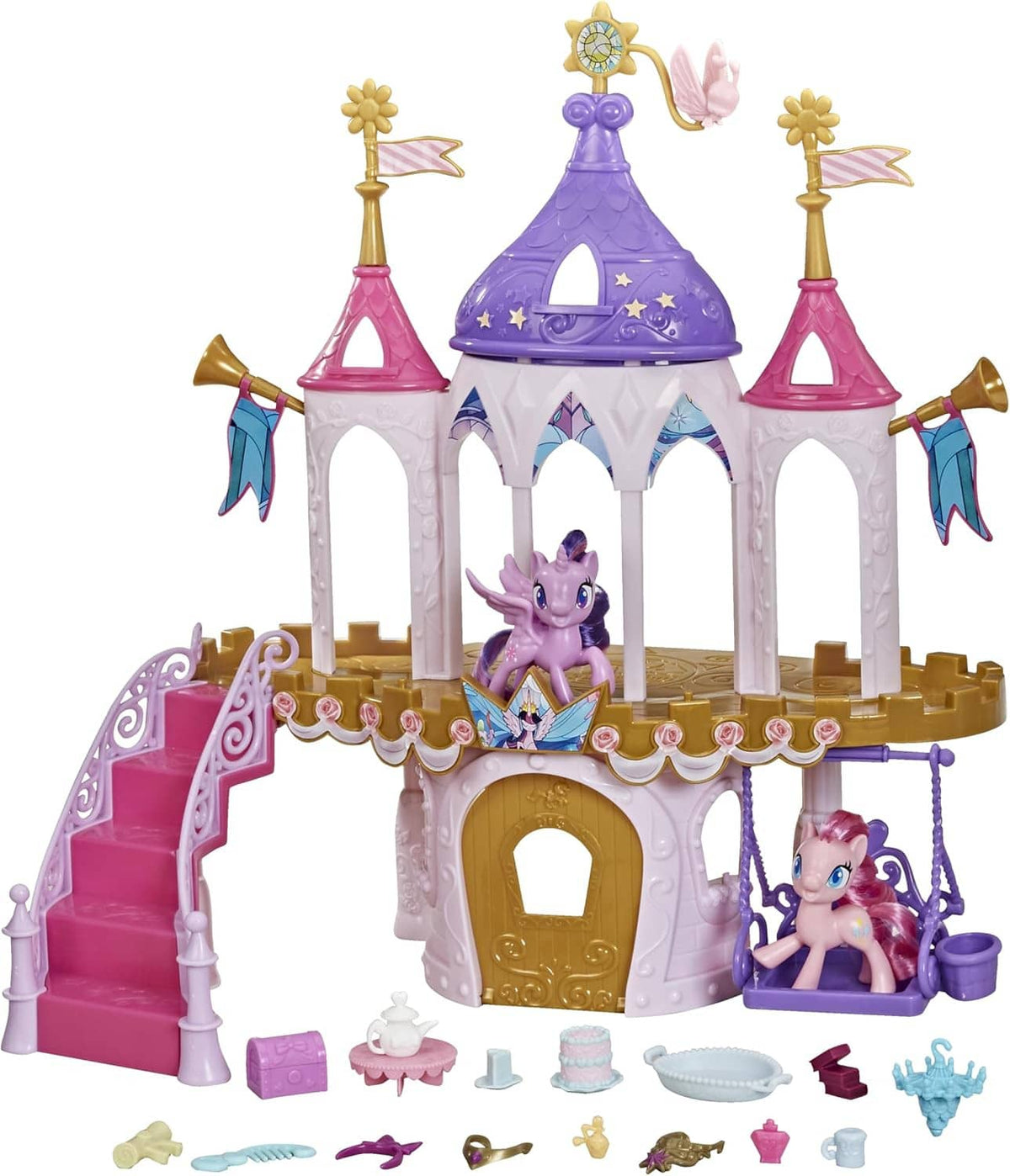 Pony friendship castle playset with purple central tower, pink stairs, and pony figure seating