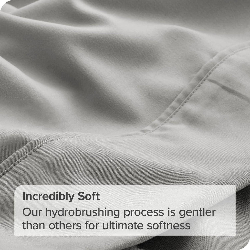 Light grey flat sheet close-up showing stitched seam along the edge