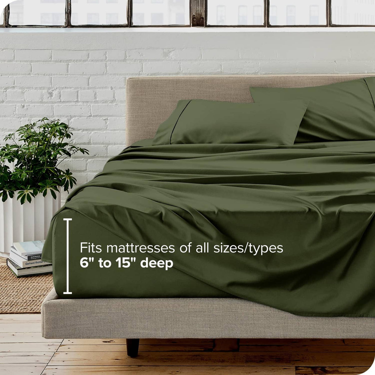 Olive green bed sheet set on a beige mattress, with pillowcases
