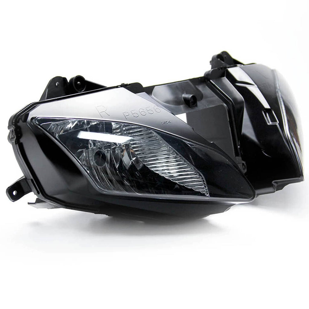 Front headlight assembly with clear lens and black housing, angled view on white