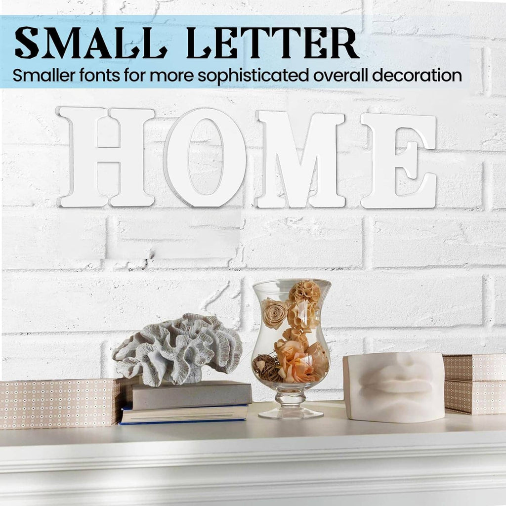 White unfinished wooden letters spelling HOME on a decorative shelf