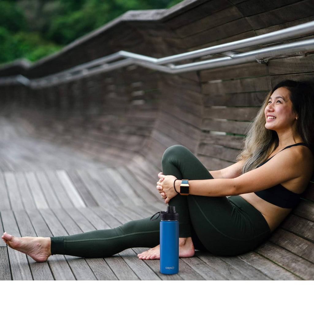 Small insulated water bottle with blue body and black spout lid