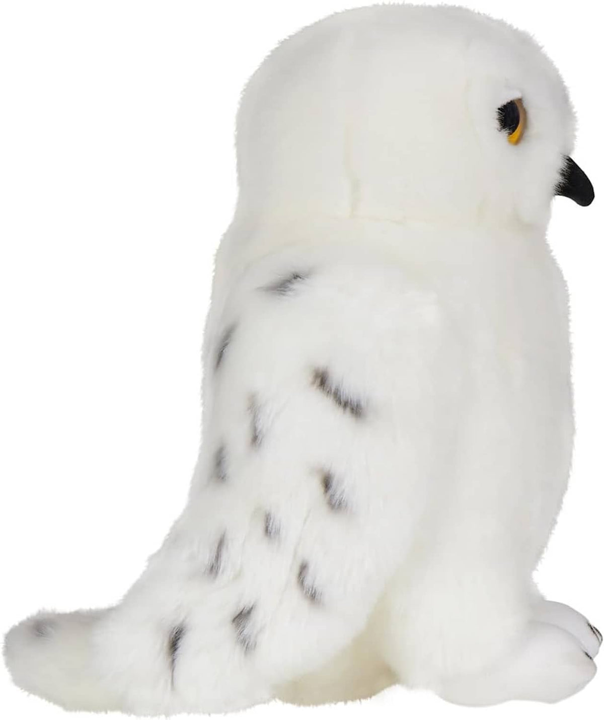 Plush snowy owl toy shown from the side with speckled markings and soft white fur
