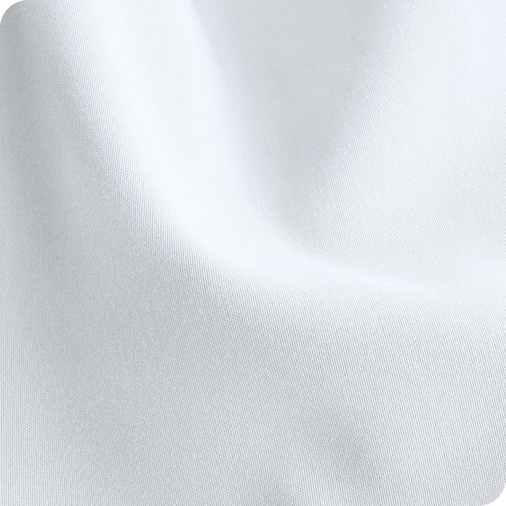 White microfiber crib fitted sheet fabric close-up, smooth texture
