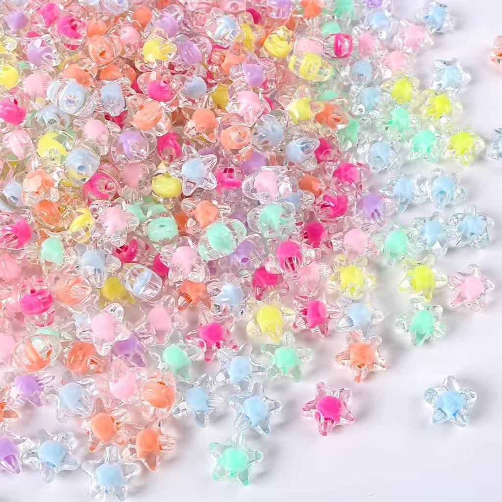 Close-up mix of transparent star beads in pink, blue, green, yellow, and orange