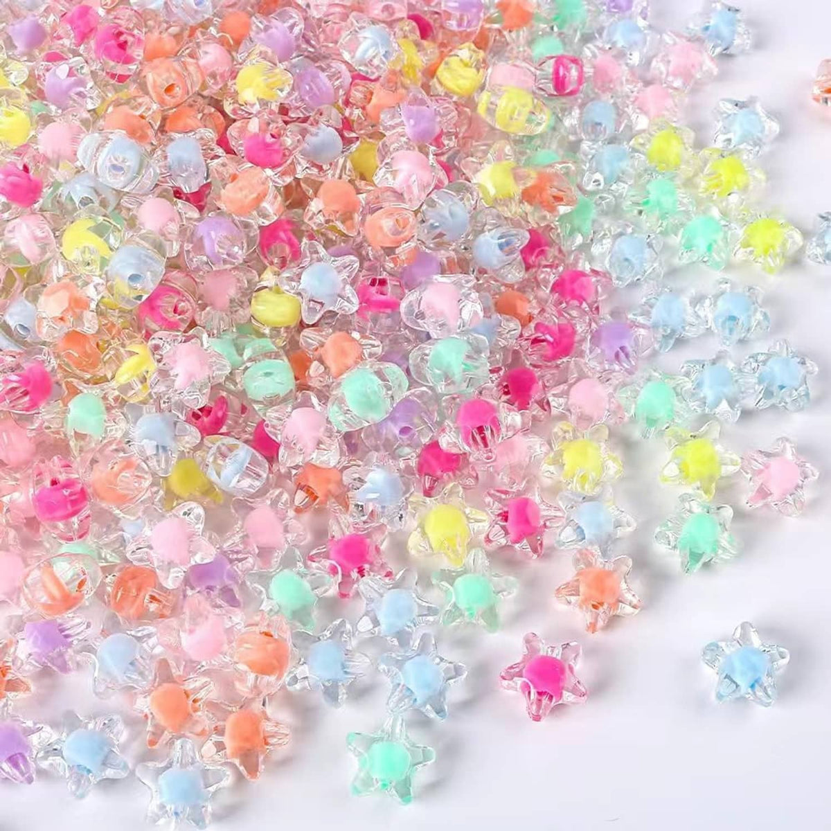 Close-up mix of transparent star beads in pink, blue, green, yellow, and orange