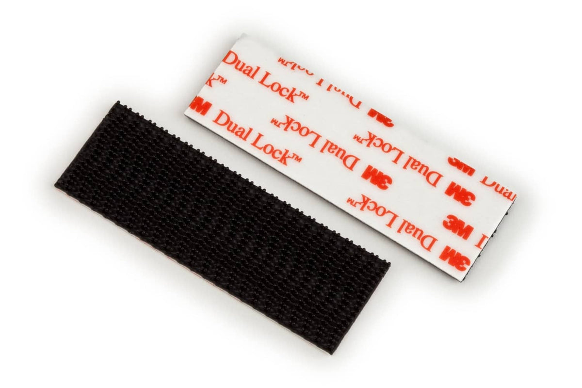 Two black interlocking fastener strips with red-and-white 3M label backing