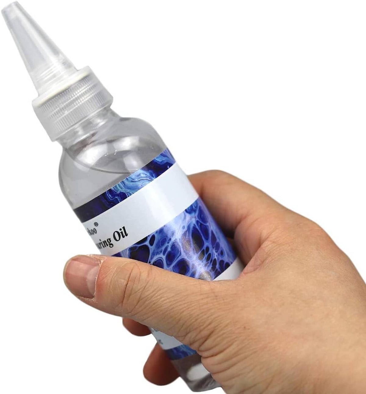 Hand holding clear silicone pouring oil bottle with blue label