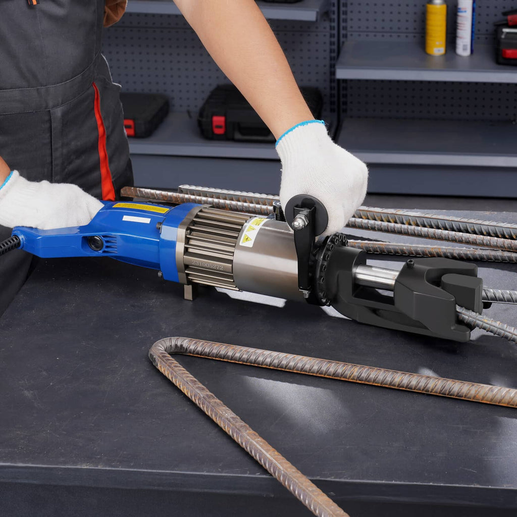 Hydraulic electric rebar bender bending two rebar pieces on flat work surface