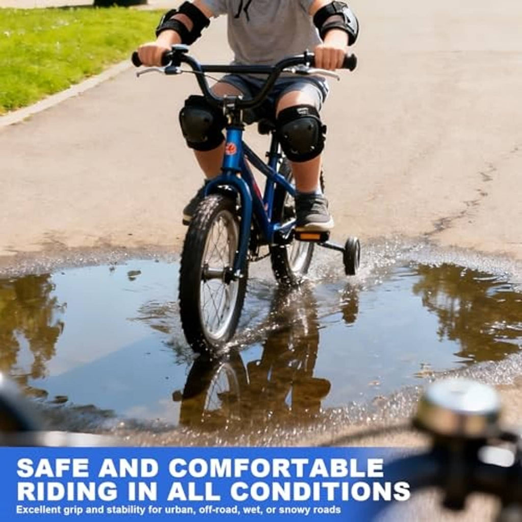 Black 16x2.4 kids bike tire with knobby tread pattern and valve stem