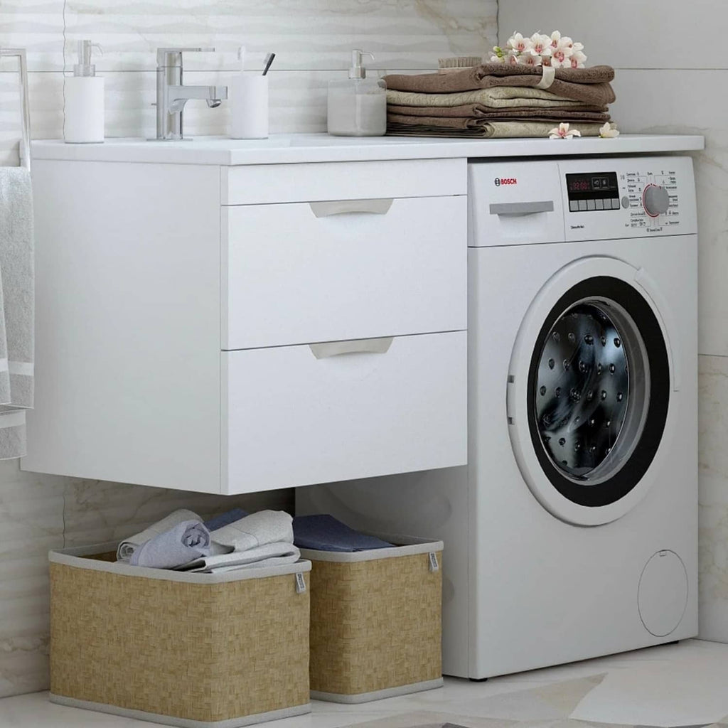 White clothes dryer next to cabinets and storage bins in a modern laundry room