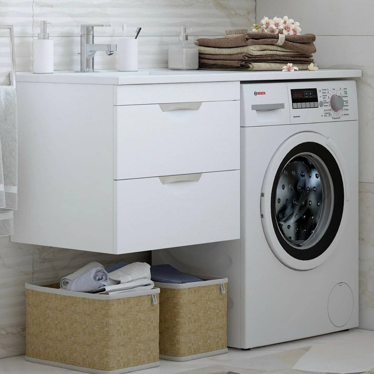 White clothes dryer next to cabinets and storage bins in a modern laundry room