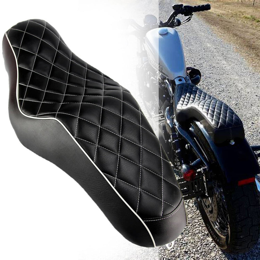 Black contoured motorcycle seat with diamond stitching and white edge piping