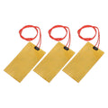 Three yellow heater film heating plates with red wire leads
