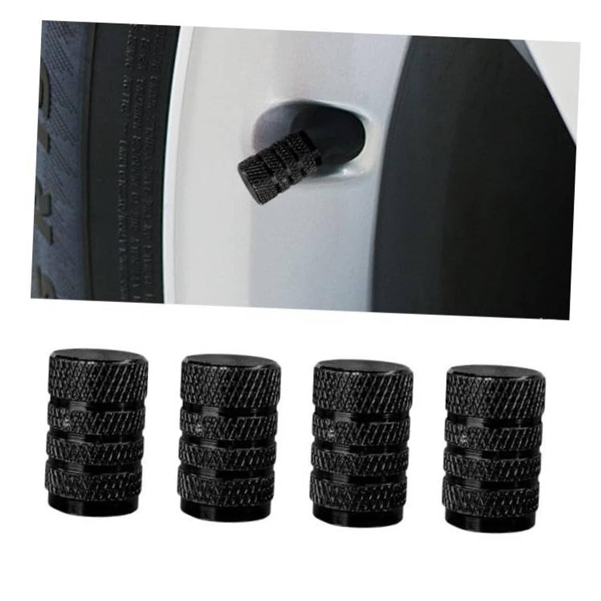Four black textured tire valve stem caps with ribbed grip