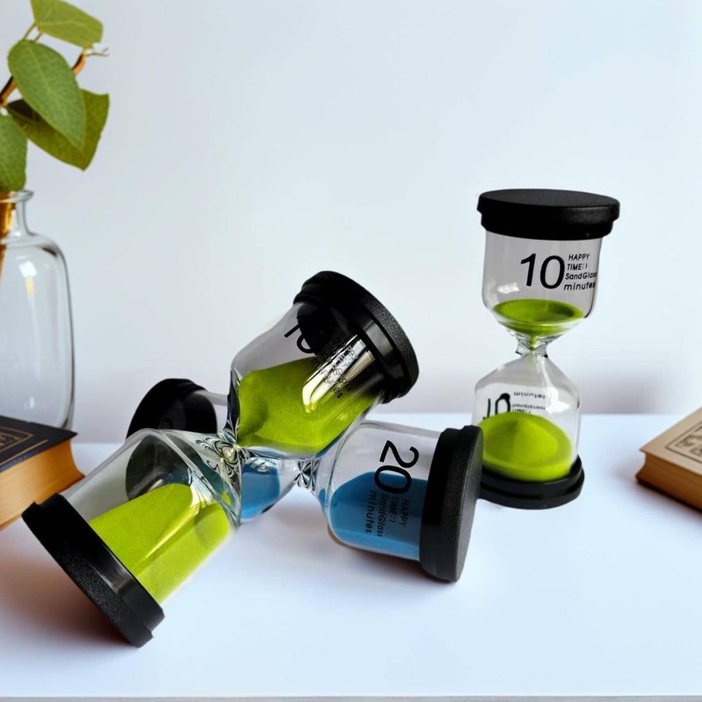Small glass sand timers with blue and green sand, black caps and bases