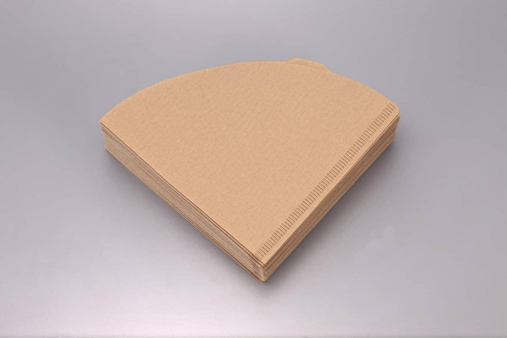 Stack of natural paper coffee filters, folded cone sheets