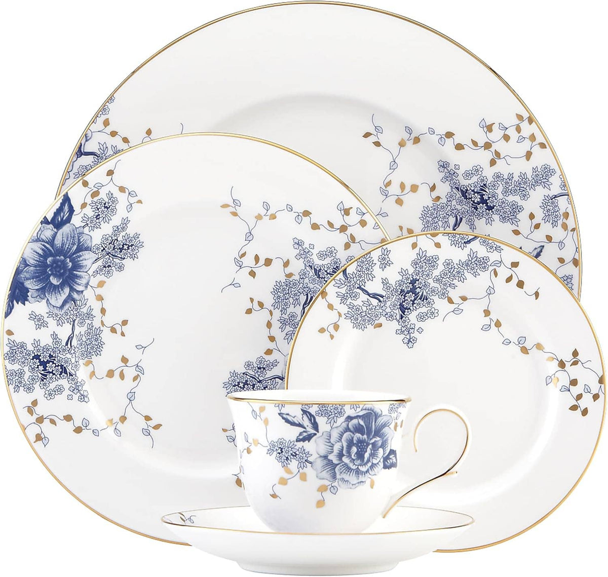 Porcelain place setting with blue floral cup and saucer, plus large dinner and accent plates