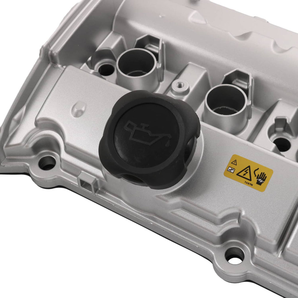Valve cover interior with black round cap, sensor port holes, and molded warning label