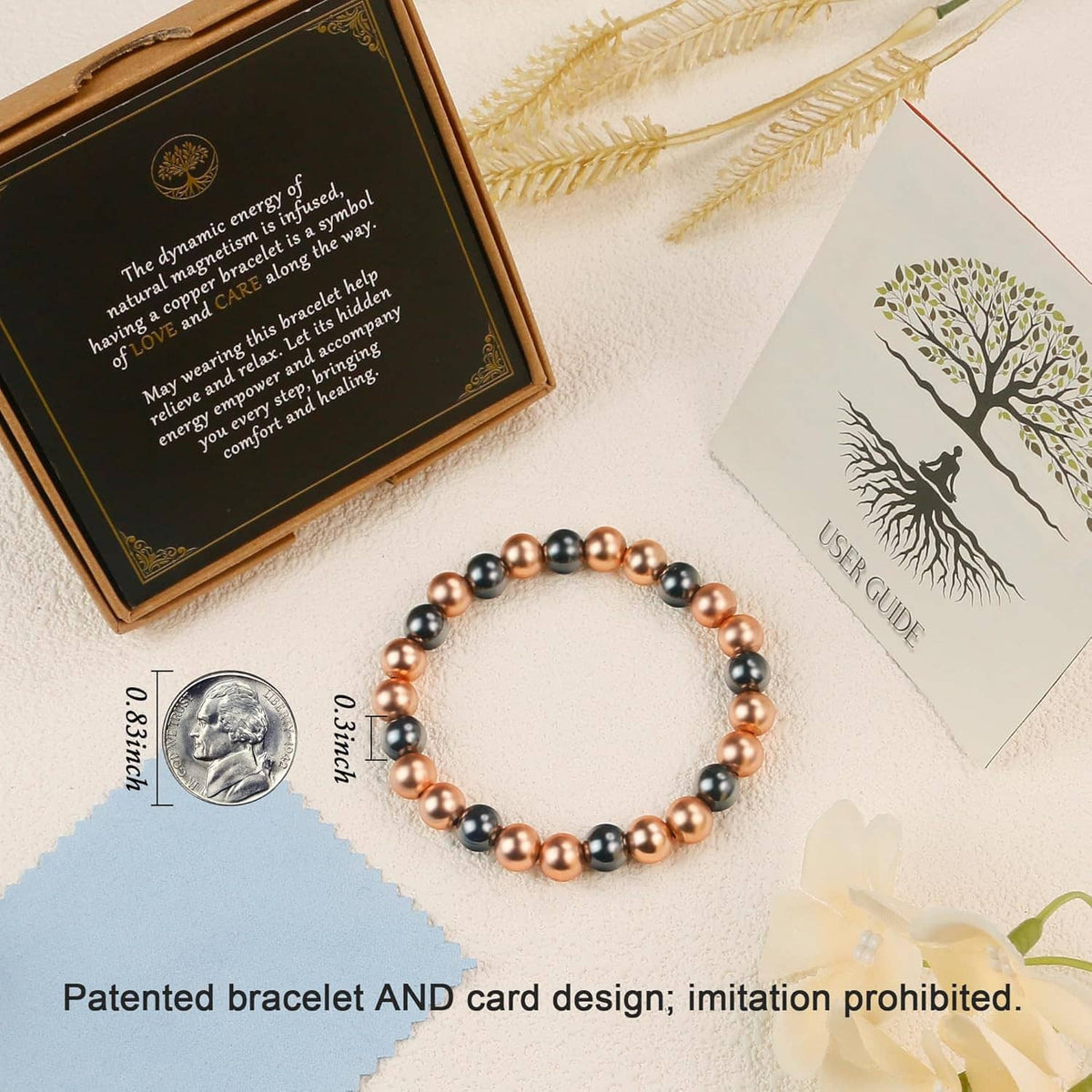 Copper and black magnetic bead bracelet displayed on a card with matching beads