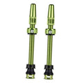 Tubeless Presta valve stems, lemon-green aluminum with black base and protective caps