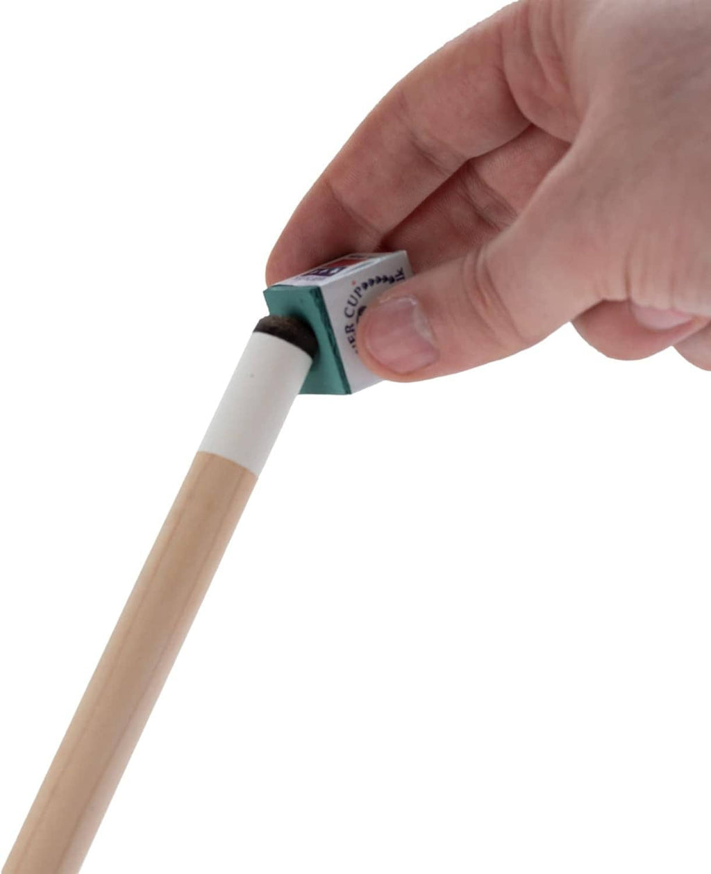 Green billiard chalk stick held in hand, wrapped piece visible