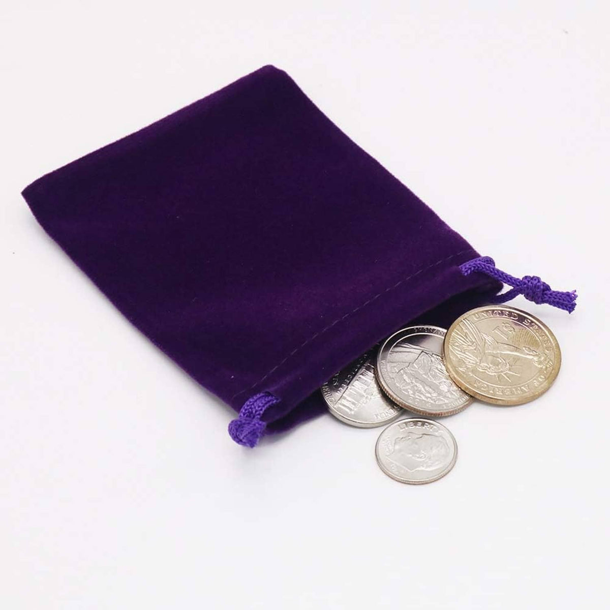 Purple velvet drawstring pouch with silver coins inside