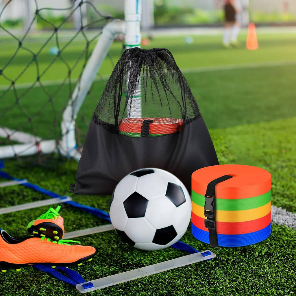 Black drawstring bag with orange flat marker discs and soccer ball on grass
