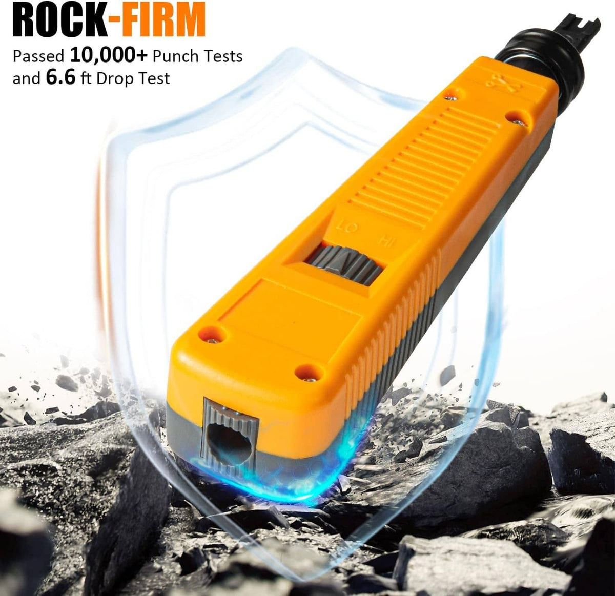 Orange punch-down tool with metal blade positioned above a connector on rocky surface.