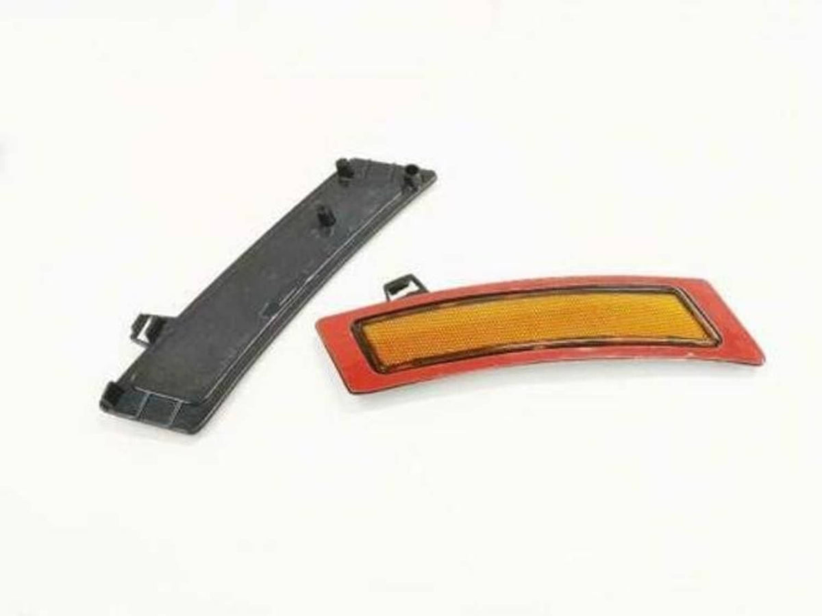 Amber side marker reflector with red trim and mounting bracket
