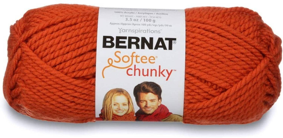 One orange super bulky chunky yarn skein with label wrapped around the center