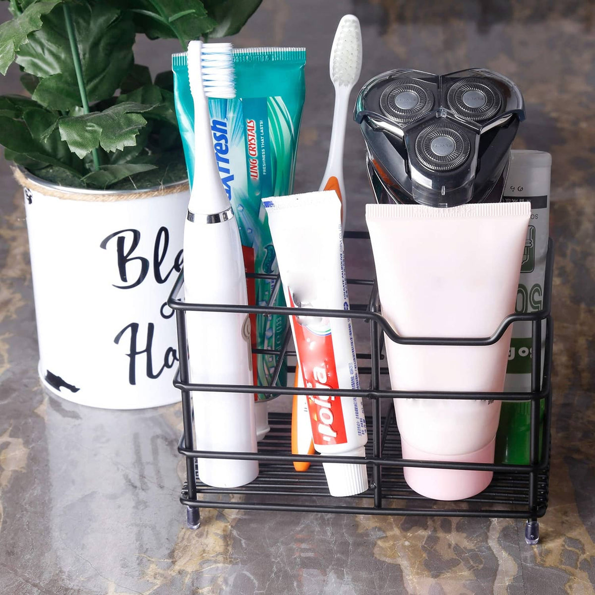 Toothbrush holder with two compartments holding toothbrushes and toothpaste tubes