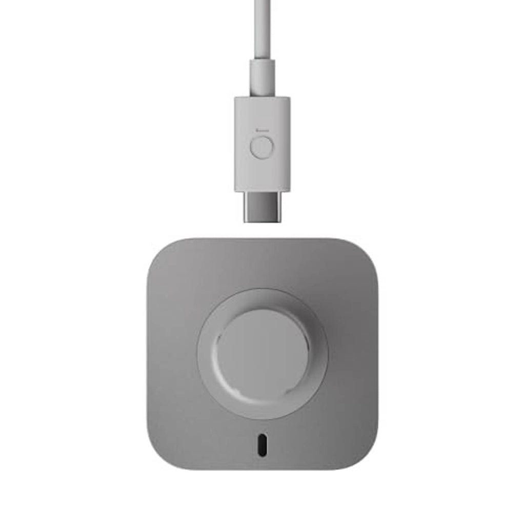 Gray charging dock with centered round cradle and USB-C plug on cable