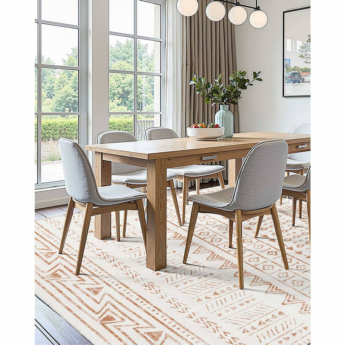 Beige geometric area rug with brown border and diamond pattern under dining table