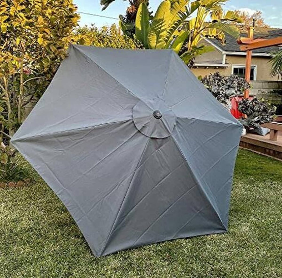 Gray umbrella canopy replacement, angled view with center knob and rib seams