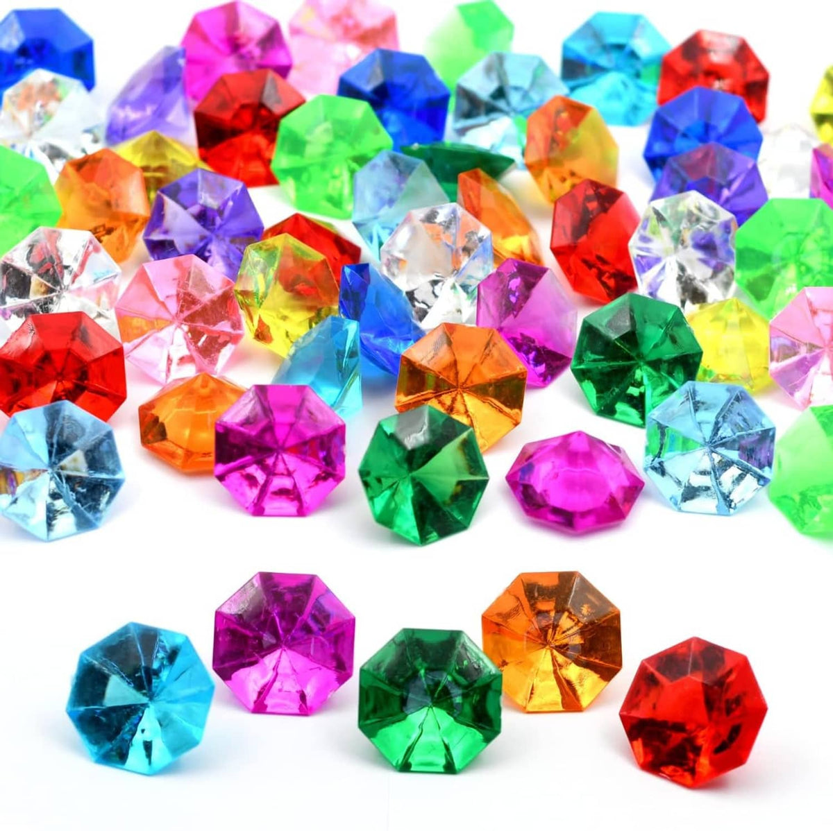 Multicolor faceted acrylic diamond gems, reflective octagon stones on a white background