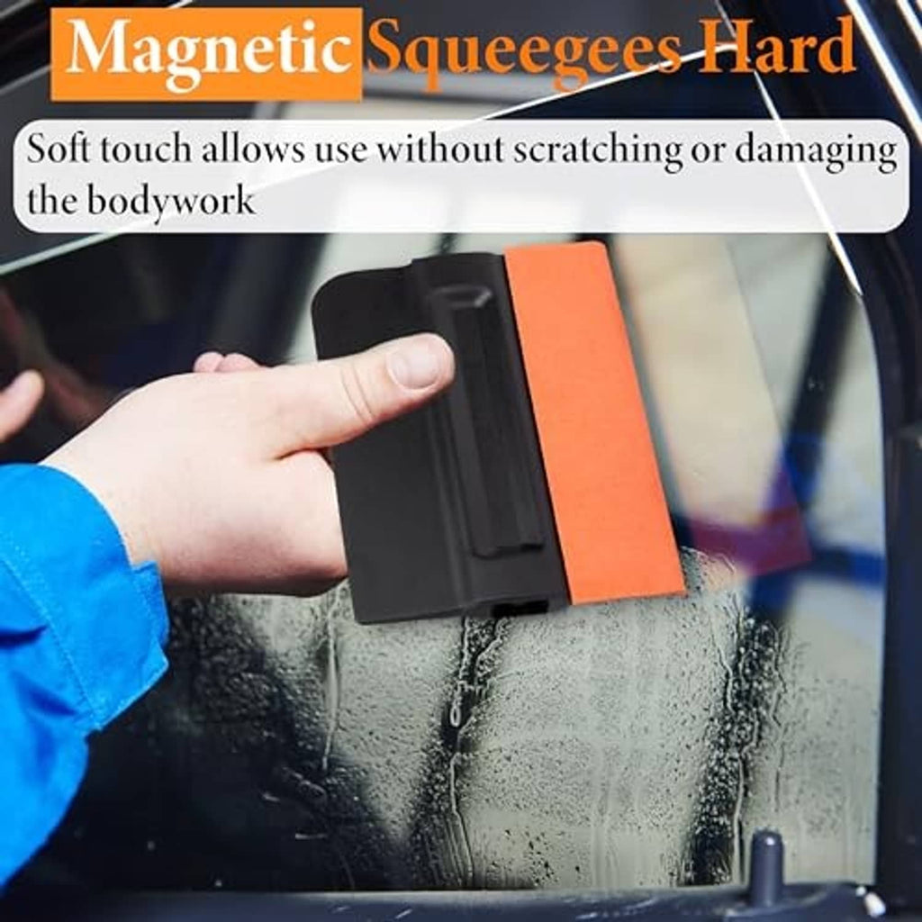 Handheld magnetic squeegee with black body and orange felt pad for window smoothing