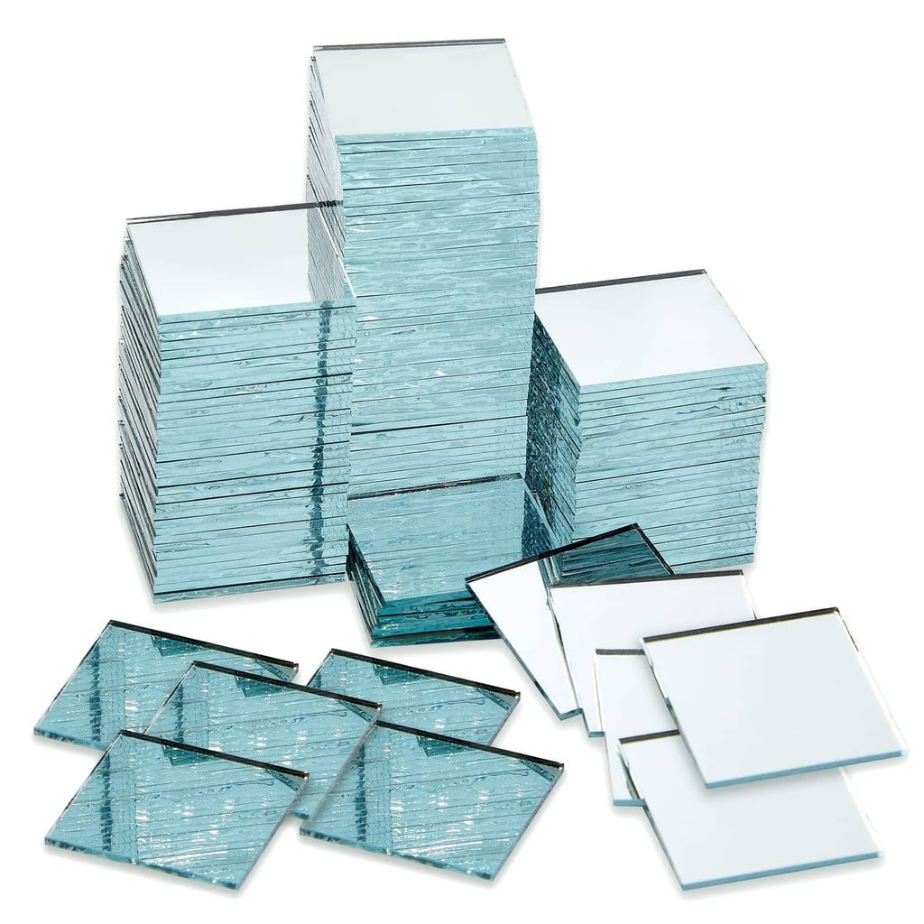 Small square glass mirror tiles, blue-tinted finish, mixed stack and loose pieces