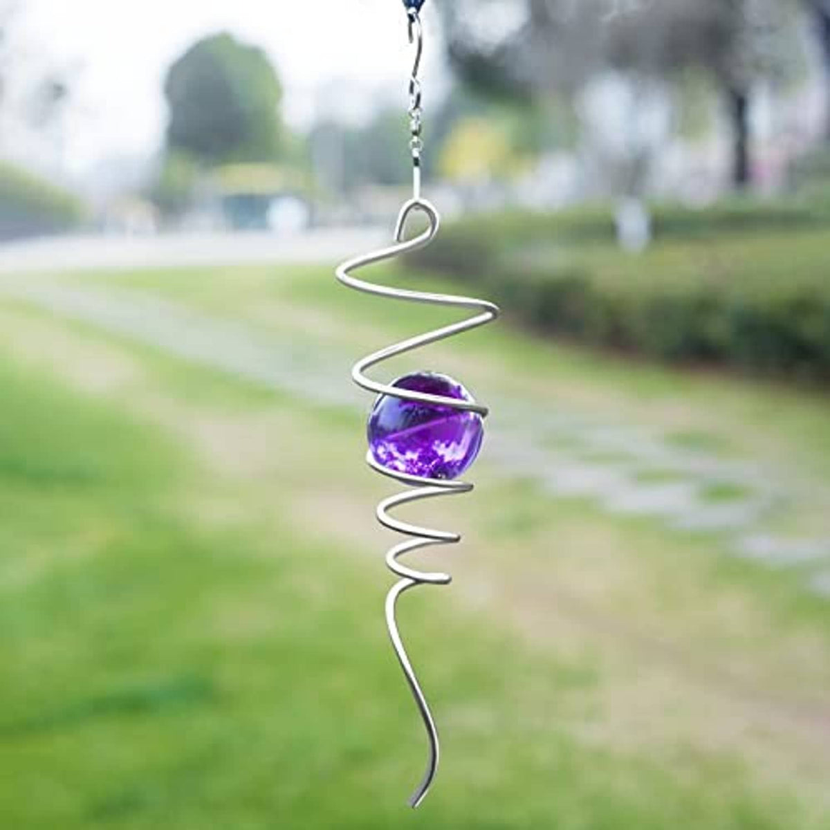 Silver spiral tail wind spinner with purple gazing ball and hanging chain