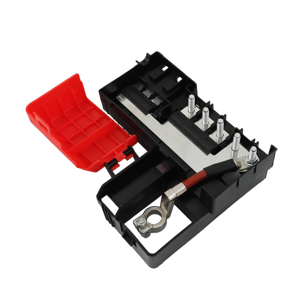 Battery fuse block with open black cover and red plastic cap, showing metal terminal posts