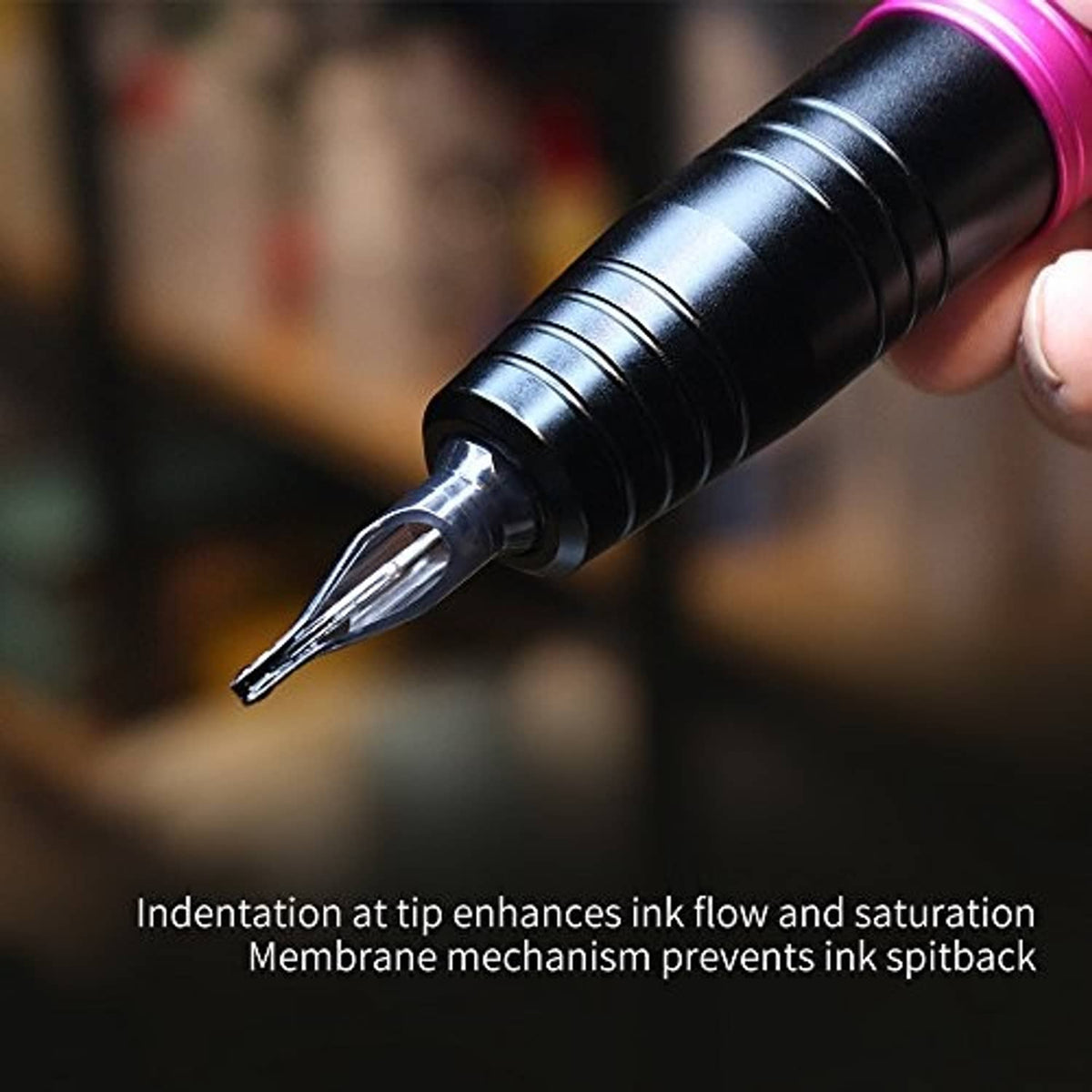 Dragonhawk Mast tattoo needle cartridge tip on a pen grip, close-up
