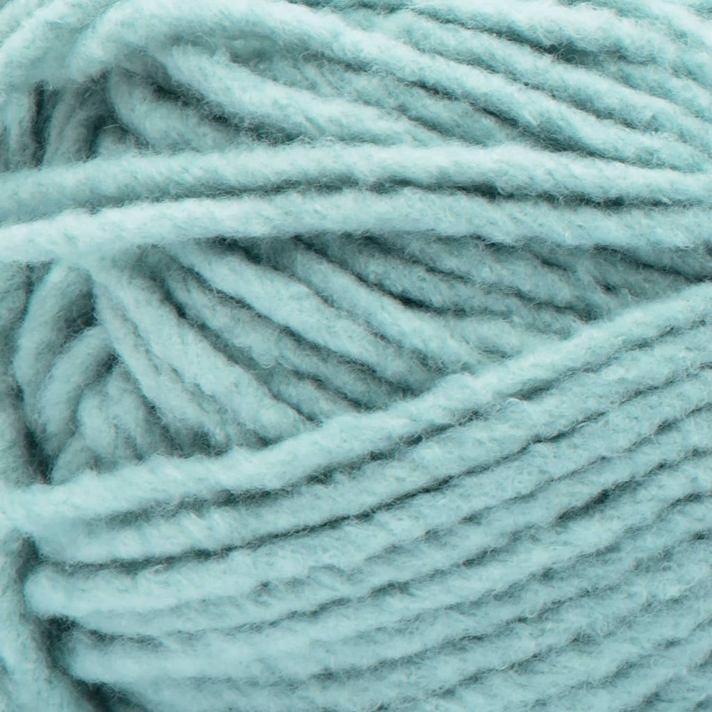 Light blue Bernat Forever Fleece super bulky yarn close-up with fuzzy loop texture