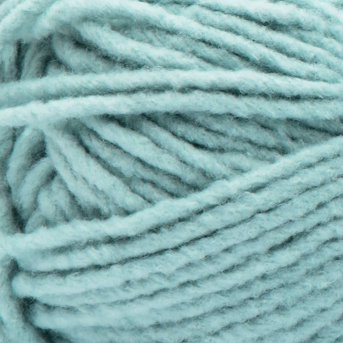 Light blue Bernat Forever Fleece super bulky yarn close-up with fuzzy loop texture