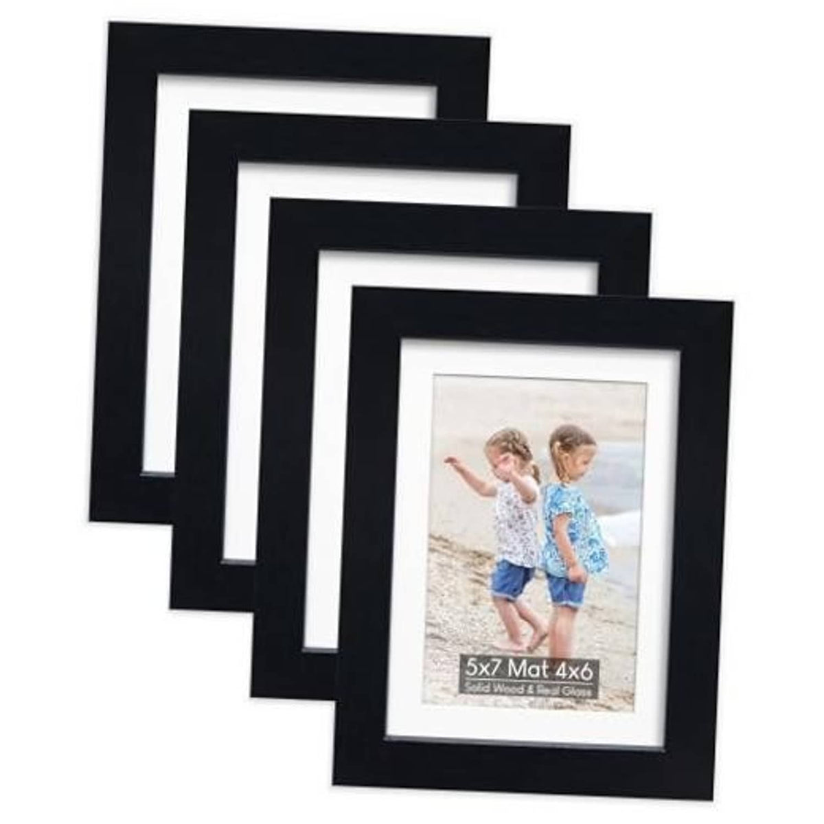 Set of four black wood picture frames with white mat and photo inserts