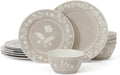 Taupe dinnerware set with white leaf-and-floral medallion plates and bowls